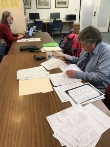 Photo of volunteers doing research